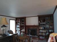 A fresh coat of light paint brightens the room, creating a more open and inviting space.