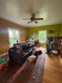 Living room features a unique combination of warm and vibrant tones.