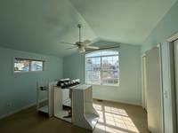 Light blue walls and vaulted ceiling. Good natural light.