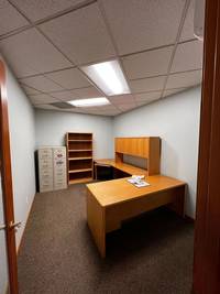 Interior office space refreshed with neutral tones to enhance lighting and functionality.