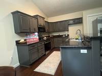A complete interior painting project featuring a modern gray finish that refreshed and elevated the overall kitchen space.