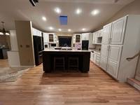 A full cabinet refresh that brings new life, brightness, and elegance to the kitchen—without replacing the cabinets.