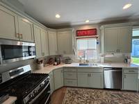 Freshly painted cabinets and walls that instantly brighten up the entire kitchen.