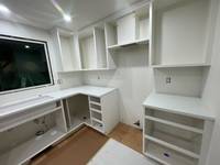 Corner view of the cabinets showing smooth finishes and detailed shelving for added storage.