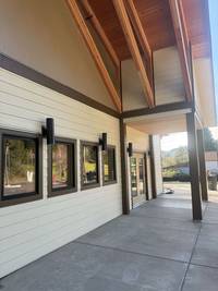Exterior walkway and entrance section completed with clean masking lines and professional commercial paint finishes.